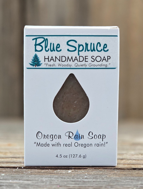 Boxed Blue Spruce Handmade 4.5 oz Soap with a raindrop cutout to view and to smell this clean, slightly woodsy scent. "Made with real Oregon rain!"
