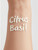 The word "Cool Citrus Basil" written on a forearm with our creamy lotion