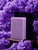 Lilac flowers surround this pretty lilac handmade soap bar.