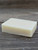 Unboxed colorant free Peppermint Lavender Pure Essence Handmade full bar soap sitting on a wooden background.