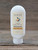 8 oz bottle of Lemon Orange Blossom Moisturizing Lotion with bright citrus graphics on the label, shown on a wooden background.