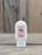 2.5 oz bottle of Cranberry Moisturizing Lotion on a wooden surface, featuring cranberry imagery on the label.
