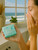 A woman washing her face with this mild Ocean Mist scented bar soap.