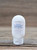 2.5 oz bottle of Pure & Natural Unscented Moisturizing Lotion on a wooden surface, featuring a clean, minimal label design.