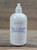 16 oz pump bottle of Pure & Natural Unscented Moisturizing Lotion enriched with nourishing plant oils, displayed on a wooden surface.