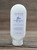 8 oz bottle of Rain Moisturizing Lotion with fresh, clean rain graphics on the label, shown on a wooden background.