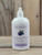 16 oz pump bottle of Blackberry Vanilla Moisturizing Lotion enriched with sweet almond oil and vitamin E, displayed on a wooden surface.