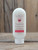 8 oz bottle of Peppermint Moisturizing Lotion with peppermint leaf graphics on the label, shown on a wooden background.
