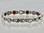 This stainless steel mineral & magnet bracelet has 5/16" wide x 1/2" long links with 14 alternating pieces of Neodymium magnets, Germanium, Infra-Red and Anion negative ion in a 7 3/4"