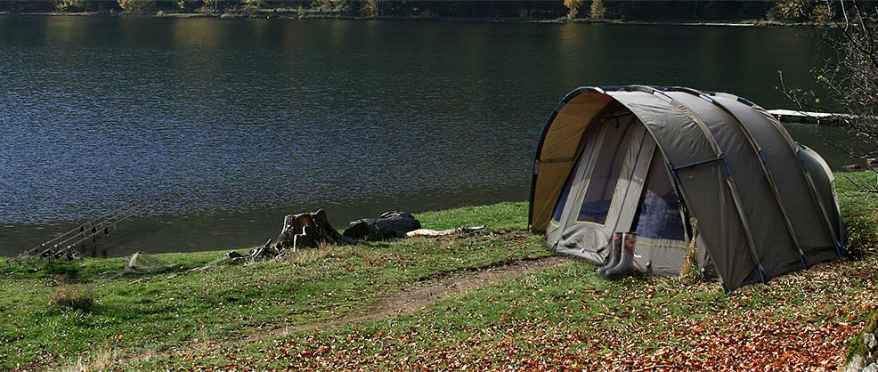 Global Outdoors: Tent by a lake