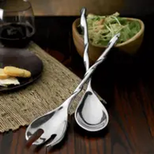 Introducing the Twisted Server S/2, the perfect addition to your home serverware collection. Crafted with high-quality stainless steel, these salad servers are not only durable but also exude elegance. Whether you're hosting a dinner party or simply enjoying a meal with your loved ones, these servers will elevate your dining experience. The twisted design adds a touch of sophistication, making them ideal for special occasions like weddings. They also make for a thoughtful and stylish gift for newlyweds or housewarmings. Upgrade your serving utensils with the Twisted Server S/2 and impress your guests with your impeccable taste.