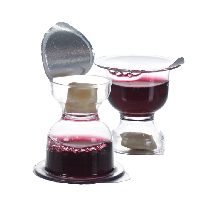 WCC Chalice prefilled communion cup with Concord grape juice and bread, lid partially opened