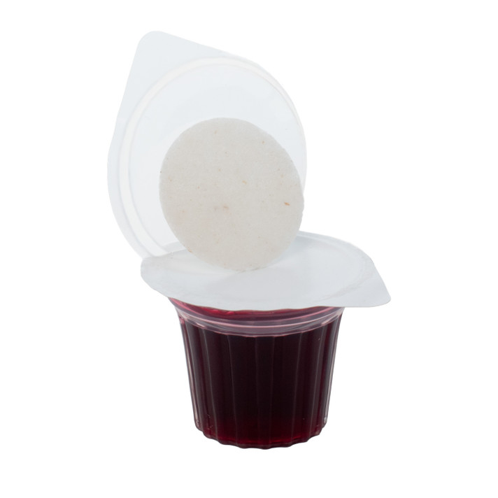 Close-up of Elements communion cup with wafer and grape juice compartments visible