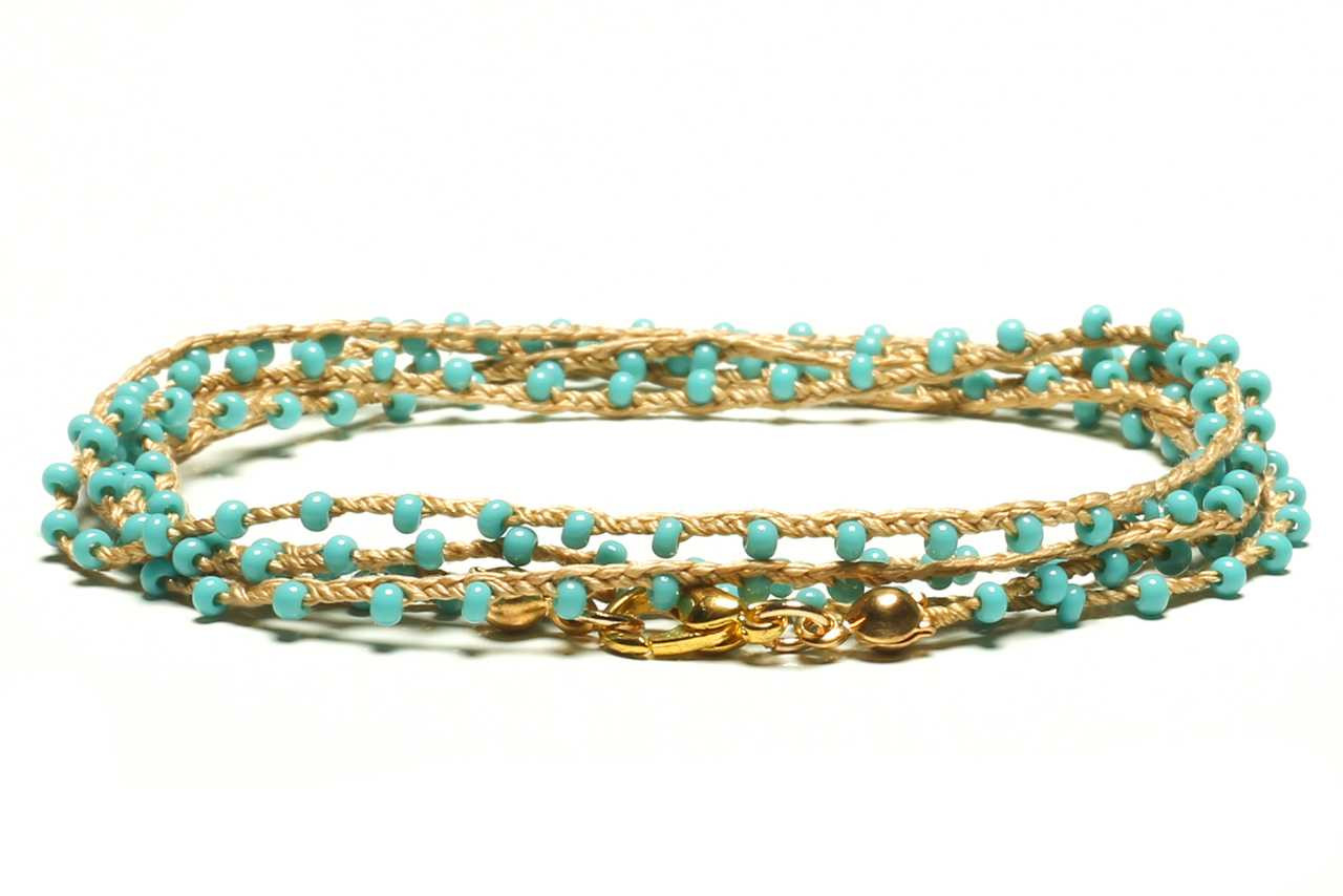 The Gipsy Glow: Holi Bracelet, Hand-Woven, Made of Natural Raffia Thread, and Caramel Lurex Thread. Gold Colored Chain Wire