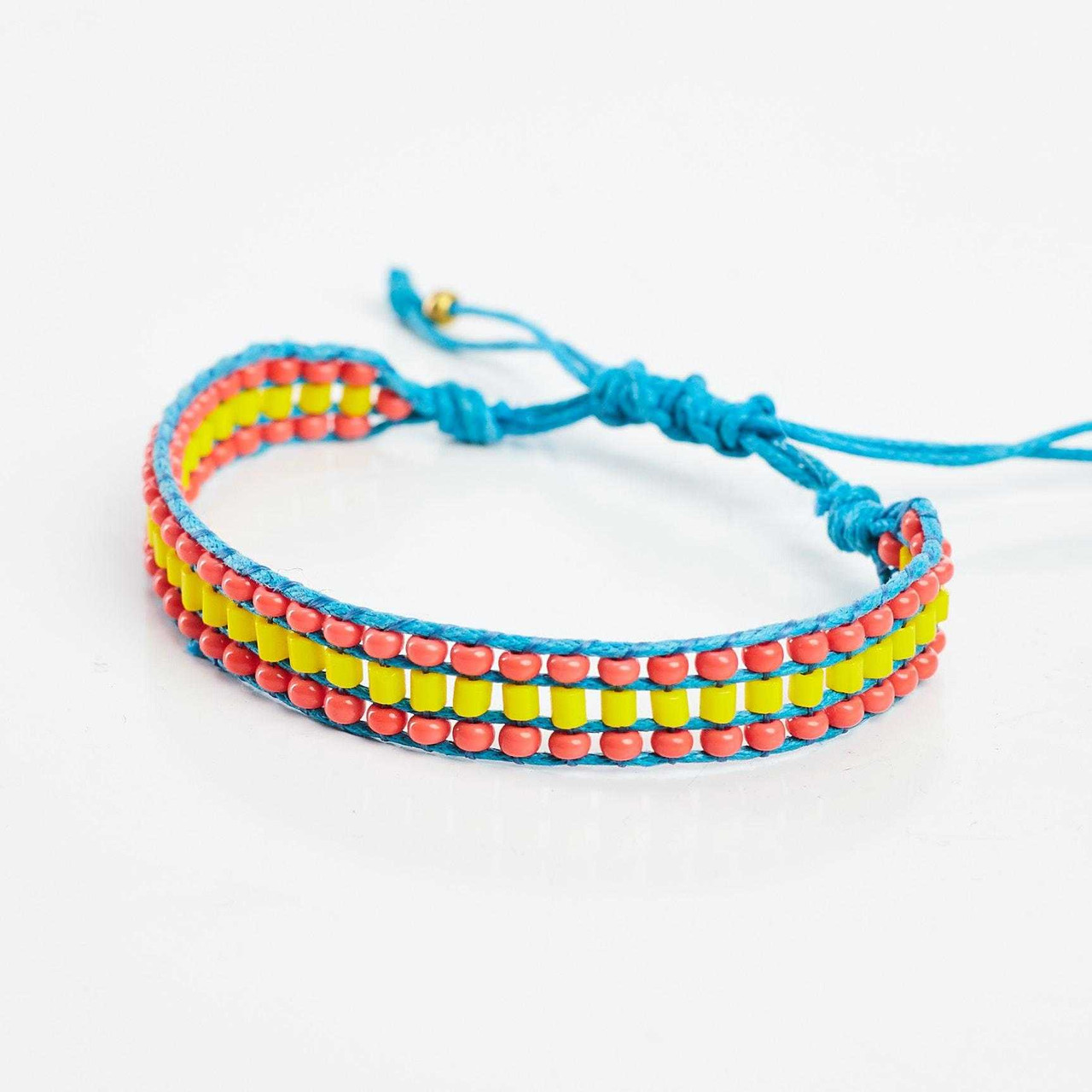 Braided colorful rope friendship bracelets handmade background Stock Photo