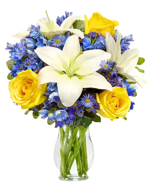 Scenic Skye floral arrangement with yellow roses, blue delphinium, and white lilies in a clear glass vase, Phoenix florist