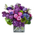 Fresh Picked and Purple is a garden-style arrangement with purple roses, lilac, hydrangea, lisianthus, hyacinth, and green trick. A vibrant bouquet full of spring charm.