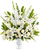 Graceful Tribute white and green funeral flower arrangement in a white urn