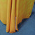 As an 8-foot table cover, the fabric drapes to just above the floor