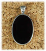 HS-176BO: Black Onyx Small Oval Pendant Mounted in Sterling Sliver w/Open Back, Engravable Area, 1-1/8 inch x 3/4 inch.