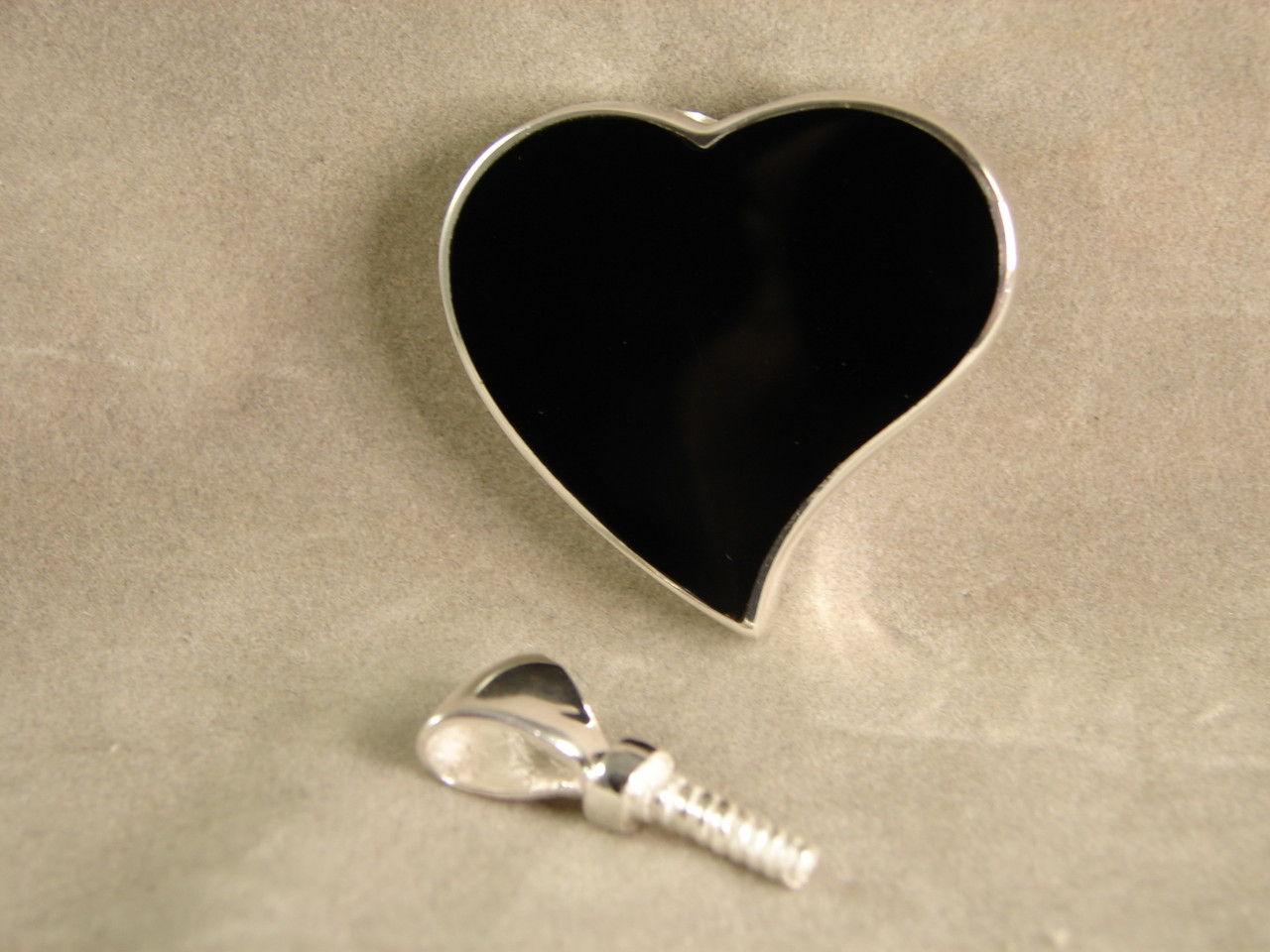 830BOCP: Black Onyx Heart Cremation Pendant Mounted in Sterling Silver, Engravable Area, 1-3/16 inch x 3/4 inch.