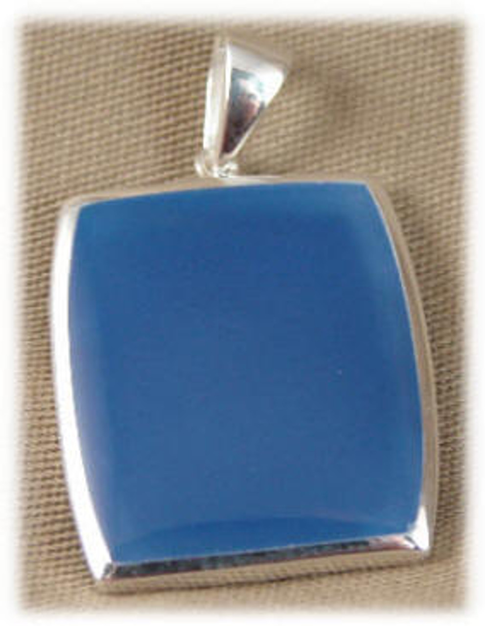 309BLU: Rectangle Blue  Onyx Pendent mounted in Sterling Silver, 7/8" wide x 1" long.