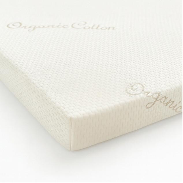 FoamOrder 40/60 Organic Cotton Case, close-up view of a white, textured organic cotton mattress cover with embossed branding.