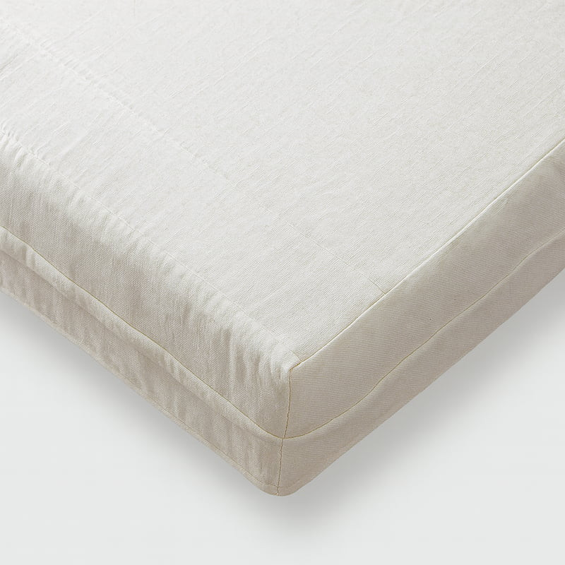 Certified Organic Cotton Muslin on a cushion