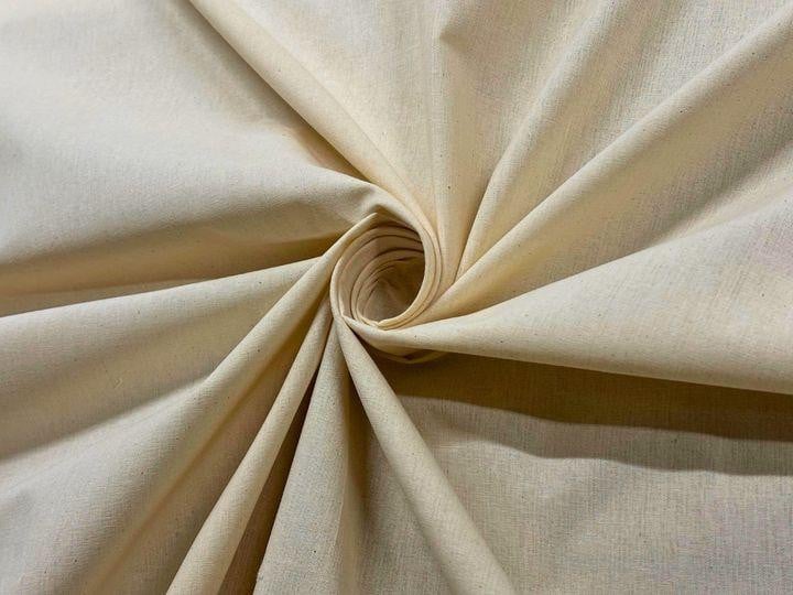 FoamOrder 100% Cotton Muslin, beige natural fabric, soft and lightweight cotton muslin material arranged in a spiral.