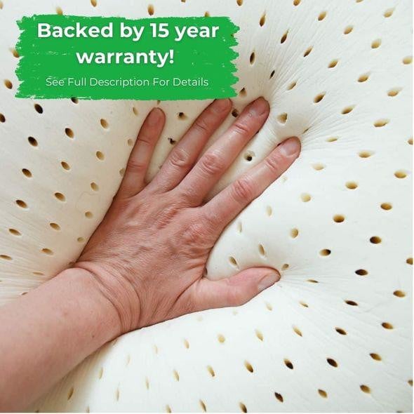 Latex Mattress Topper, hand pressing into soft, breathable latex mattress topper with small holes for ventilation.