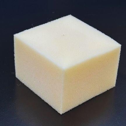 Fire Retardant Foam Sample, a white foam block with a smooth surface and square shape placed on a black background.