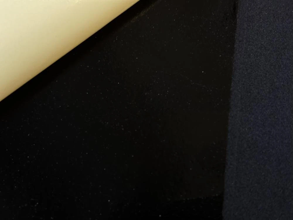 2mm Neoprene Sheet - Front peel and stick surface with black color and nylon back for versatile use.