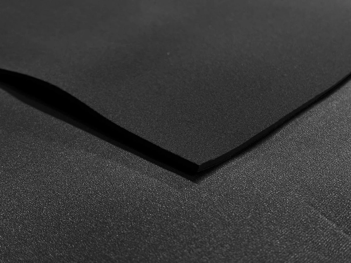 4mm Neoprene Sheet, front with colored nylon on one side and back with black nylon, for insulation or craft projects.