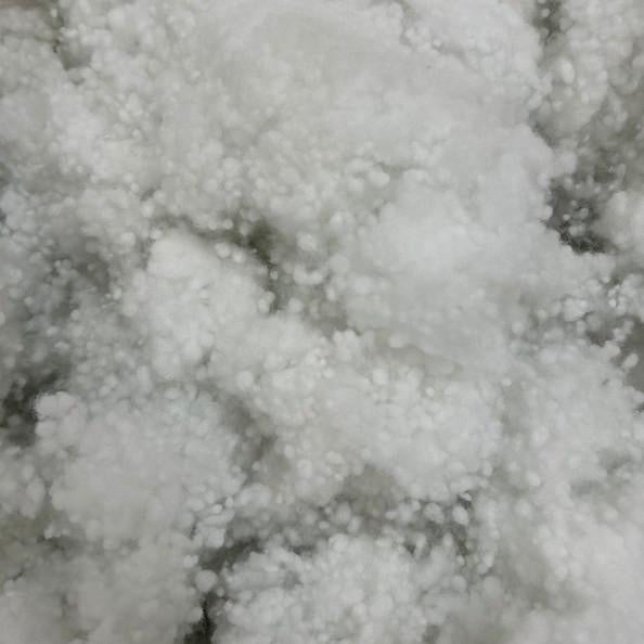 Polyester Pillow Stuffing, close-up of soft white polyester fiber filling material for pillows and cushions.