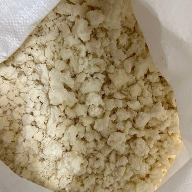 Shredded Organic Latex Foam, close-up of natural shredded latex foam pieces in a bag.
