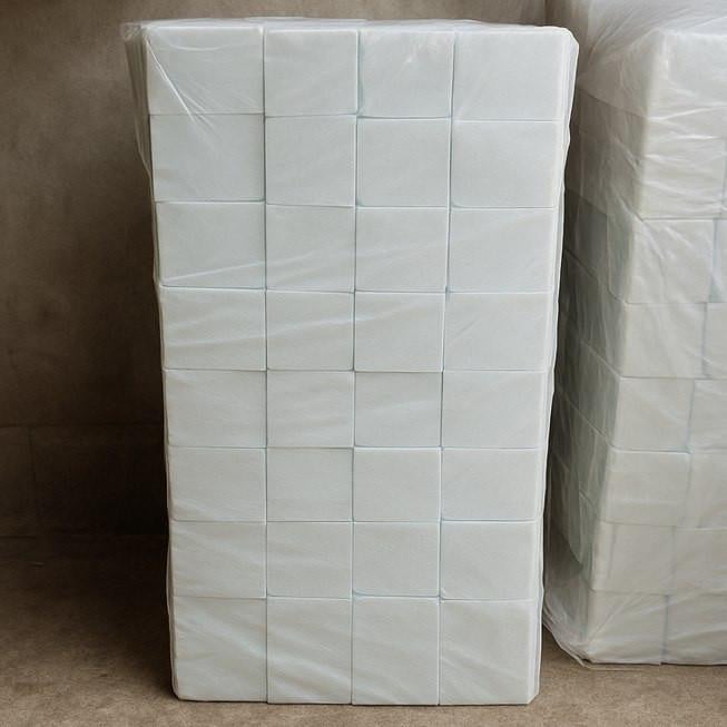 FoamOrder Foam Pit Cubes, stack of white foam cubes used for foam pits and safety areas.