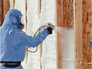 Spray polyurethane foam insulation being applied