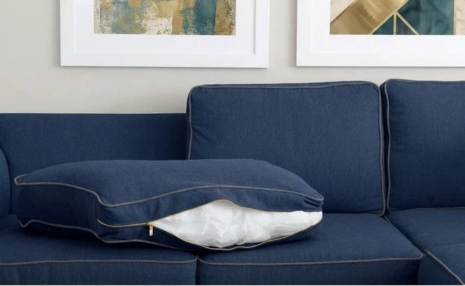 Cross-section of a couch cushion showing the foam core wrapped in Dacron batting inside the cover
