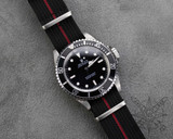Black and red nylon watch strap on a Rolex Submariner