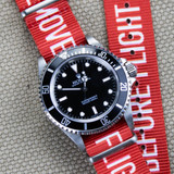 Remove before flight watch band on a Rolex Submariner