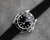 Black suede watch strap on a Rolex Submariner