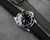 Black rubber watch strap with deployant clasp
