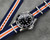 Navy white and orange nylon watch strap on a Rolex Submariner