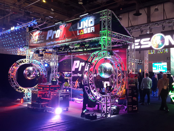 ProX professional circular trade show display structure installed at an exhibition featuring custom branding, lighting, and attendee engagement areas