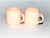 2 small mugs glazed in cream 