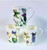 A set of 3 Bone china mugs with wild  flowers & butterfly design