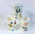 A set of 3 Bone china mugs with wild  flowers & butterfly design