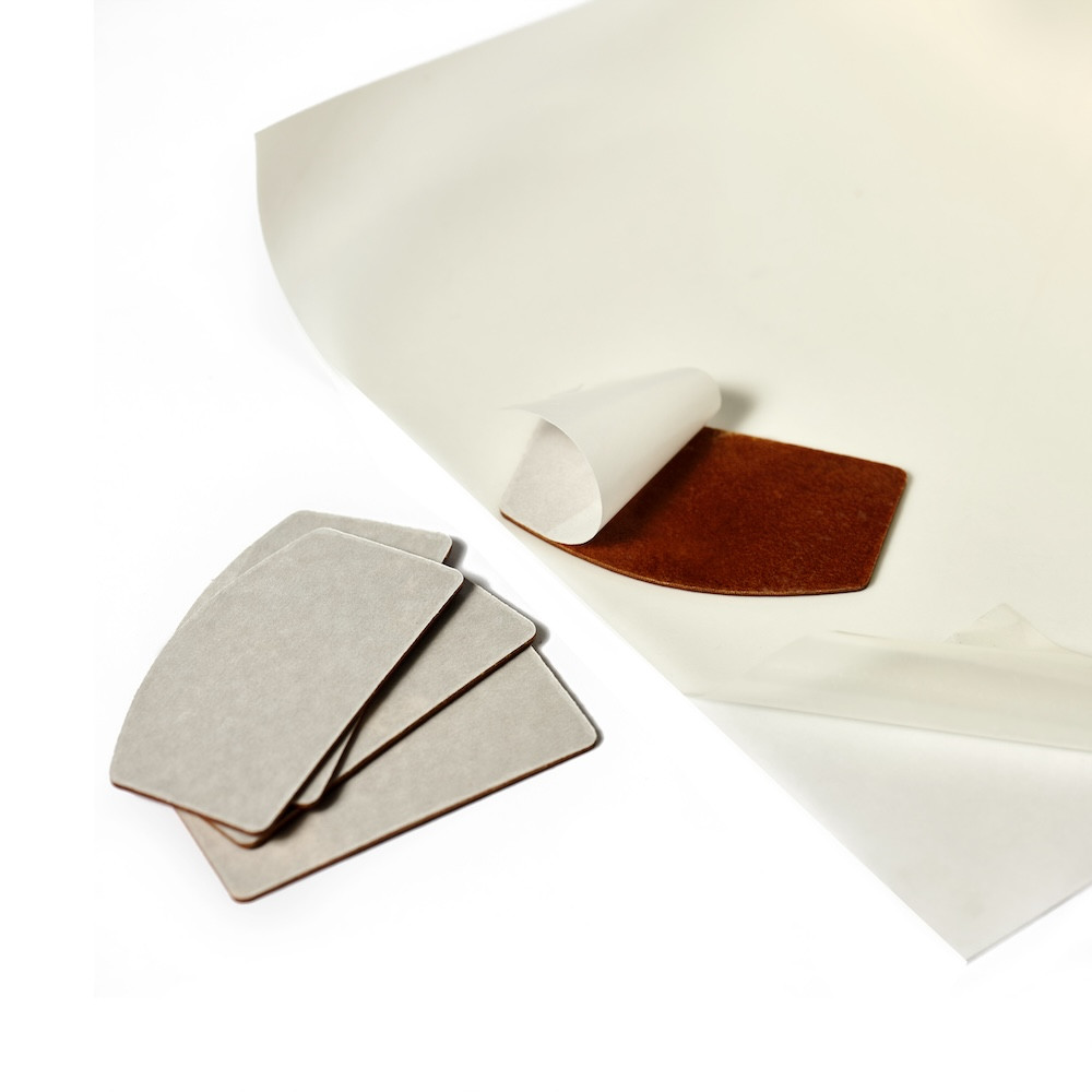 Panels with thermal adhesive backing