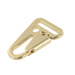 Swivel snap fastener with leather beige bag strap on a wooden background.  Metal carabiner with swivel clip or hook. Small gold fittings close-up in  selective focus. 4538241 Stock Photo at Vecteezy