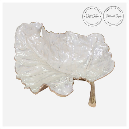 Overhead view of Nadine Leaf Tray showcasing sculpted white glaze surface. Overhead view of Nadine Leaf Tray showcasing sculpted white glaze surface.